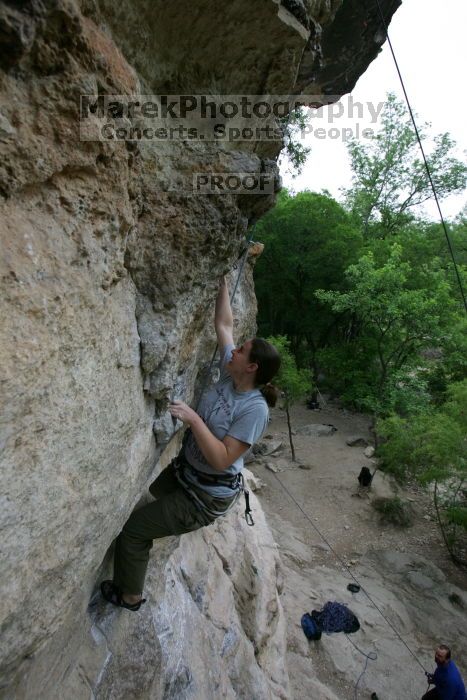 Hannah Norton top rope climbing Diving for Rocks (5.10d), photographed from  the third bolt of Magster (5.10a).  It was another long day of rock climbing at Seismic Wall on Austin's Barton Creek Greenbelt, Saturday, April 11, 2009.

Filename: SRM_20090411_16103152.JPG
Aperture: f/5.0
Shutter Speed: 1/250
Body: Canon EOS-1D Mark II
Lens: Canon EF 16-35mm f/2.8 L