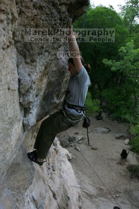 Hannah Norton top rope climbing Diving for Rocks (5.10d), photographed from  the third bolt of Magster (5.10a).  It was another long day of rock climbing at Seismic Wall on Austin's Barton Creek Greenbelt, Saturday, April 11, 2009.

Filename: SRM_20090411_16104957.JPG
Aperture: f/5.0
Shutter Speed: 1/250
Body: Canon EOS-1D Mark II
Lens: Canon EF 16-35mm f/2.8 L