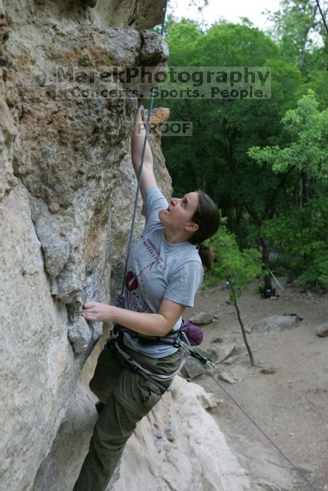 Hannah Norton top rope climbing Diving for Rocks (5.10d), photographed from  the third bolt of Magster (5.10a).  It was another long day of rock climbing at Seismic Wall on Austin's Barton Creek Greenbelt, Saturday, April 11, 2009.

Filename: SRM_20090411_16133364.JPG
Aperture: f/4.0
Shutter Speed: 1/250
Body: Canon EOS-1D Mark II
Lens: Canon EF 16-35mm f/2.8 L