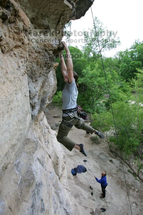 Hannah Norton top rope climbing Diving for Rocks (5.10d), photographed from  the third bolt of Magster (5.10a).  It was another long day of rock climbing at Seismic Wall on Austin's Barton Creek Greenbelt, Saturday, April 11, 2009.

Filename: SRM_20090411_16134167.JPG
Aperture: f/4.0
Shutter Speed: 1/250
Body: Canon EOS-1D Mark II
Lens: Canon EF 16-35mm f/2.8 L