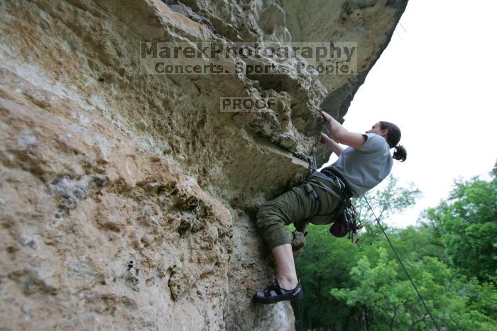 Hannah Norton top rope climbing Diving for Rocks (5.10d), photographed from  the third bolt of Magster (5.10a).  It was another long day of rock climbing at Seismic Wall on Austin's Barton Creek Greenbelt, Saturday, April 11, 2009.

Filename: SRM_20090411_16142484.JPG
Aperture: f/4.0
Shutter Speed: 1/250
Body: Canon EOS-1D Mark II
Lens: Canon EF 16-35mm f/2.8 L