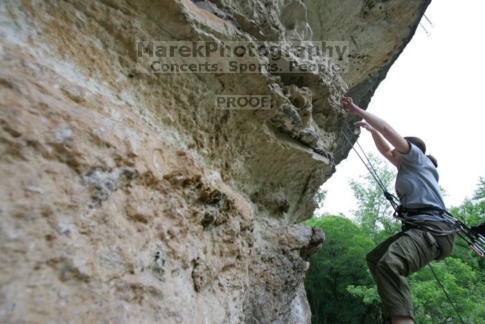 Hannah Norton top rope climbing Diving for Rocks (5.10d), photographed from  the third bolt of Magster (5.10a).  It was another long day of rock climbing at Seismic Wall on Austin's Barton Creek Greenbelt, Saturday, April 11, 2009.

Filename: SRM_20090411_16143786.JPG
Aperture: f/4.0
Shutter Speed: 1/250
Body: Canon EOS-1D Mark II
Lens: Canon EF 16-35mm f/2.8 L