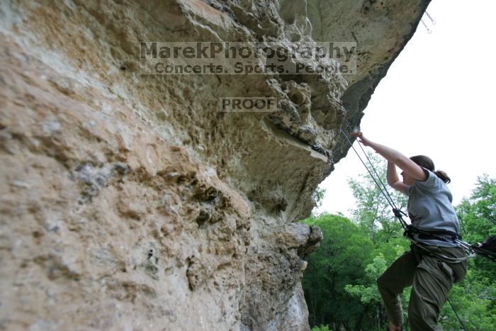 Hannah Norton top rope climbing Diving for Rocks (5.10d), photographed from  the third bolt of Magster (5.10a).  It was another long day of rock climbing at Seismic Wall on Austin's Barton Creek Greenbelt, Saturday, April 11, 2009.

Filename: SRM_20090411_16143787.JPG
Aperture: f/4.0
Shutter Speed: 1/250
Body: Canon EOS-1D Mark II
Lens: Canon EF 16-35mm f/2.8 L