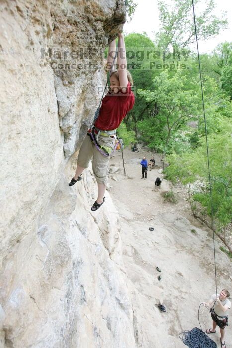 Kirsten Viering top rope climbing Diving for Rocks (5.10d), photographed from  the third bolt of Magster (5.10a).  It was another long day of rock climbing at Seismic Wall on Austin's Barton Creek Greenbelt, Saturday, April 11, 2009.

Filename: SRM_20090411_16191994.JPG
Aperture: f/4.0
Shutter Speed: 1/250
Body: Canon EOS-1D Mark II
Lens: Canon EF 16-35mm f/2.8 L