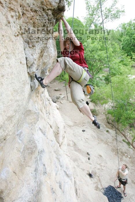 Kirsten Viering top rope climbing Diving for Rocks (5.10d), photographed from  the third bolt of Magster (5.10a).  It was another long day of rock climbing at Seismic Wall on Austin's Barton Creek Greenbelt, Saturday, April 11, 2009.

Filename: SRM_20090411_16192297.JPG
Aperture: f/4.0
Shutter Speed: 1/250
Body: Canon EOS-1D Mark II
Lens: Canon EF 16-35mm f/2.8 L