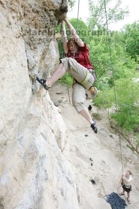 Kirsten Viering top rope climbing Diving for Rocks (5.10d), photographed from  the third bolt of Magster (5.10a).  It was another long day of rock climbing at Seismic Wall on Austin's Barton Creek Greenbelt, Saturday, April 11, 2009.

Filename: SRM_20090411_16192298.JPG
Aperture: f/4.0
Shutter Speed: 1/250
Body: Canon EOS-1D Mark II
Lens: Canon EF 16-35mm f/2.8 L