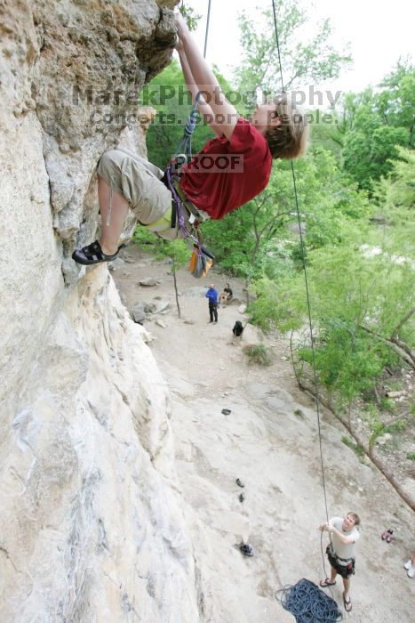 Kirsten Viering top rope climbing Diving for Rocks (5.10d), photographed from  the third bolt of Magster (5.10a).  It was another long day of rock climbing at Seismic Wall on Austin's Barton Creek Greenbelt, Saturday, April 11, 2009.

Filename: SRM_20090411_16192700.JPG
Aperture: f/4.0
Shutter Speed: 1/250
Body: Canon EOS-1D Mark II
Lens: Canon EF 16-35mm f/2.8 L