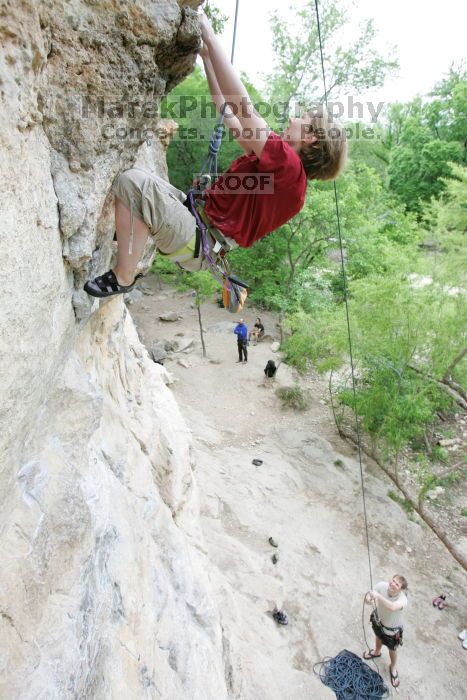 Kirsten Viering top rope climbing Diving for Rocks (5.10d), photographed from  the third bolt of Magster (5.10a).  It was another long day of rock climbing at Seismic Wall on Austin's Barton Creek Greenbelt, Saturday, April 11, 2009.

Filename: SRM_20090411_16192701.JPG
Aperture: f/4.0
Shutter Speed: 1/250
Body: Canon EOS-1D Mark II
Lens: Canon EF 16-35mm f/2.8 L