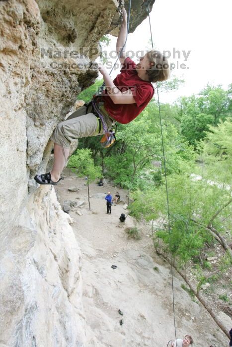 Kirsten Viering top rope climbing Diving for Rocks (5.10d), photographed from  the third bolt of Magster (5.10a).  It was another long day of rock climbing at Seismic Wall on Austin's Barton Creek Greenbelt, Saturday, April 11, 2009.

Filename: SRM_20090411_16192903.JPG
Aperture: f/4.0
Shutter Speed: 1/250
Body: Canon EOS-1D Mark II
Lens: Canon EF 16-35mm f/2.8 L