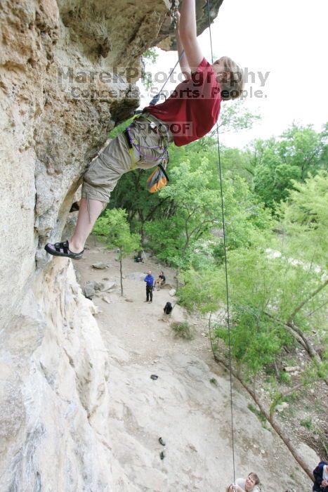 Kirsten Viering top rope climbing Diving for Rocks (5.10d), photographed from  the third bolt of Magster (5.10a).  It was another long day of rock climbing at Seismic Wall on Austin's Barton Creek Greenbelt, Saturday, April 11, 2009.

Filename: SRM_20090411_16193104.JPG
Aperture: f/4.0
Shutter Speed: 1/250
Body: Canon EOS-1D Mark II
Lens: Canon EF 16-35mm f/2.8 L