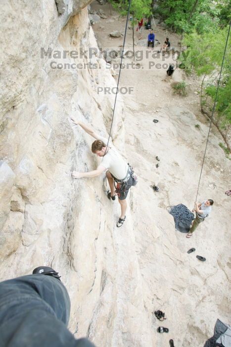 Adam Libson top rope climbing Diving for Rocks (5.10d), photographed from  the third bolt of Magster (5.10a).  It was another long day of rock climbing at Seismic Wall on Austin's Barton Creek Greenbelt, Saturday, April 11, 2009.

Filename: SRM_20090411_16233906.JPG
Aperture: f/4.0
Shutter Speed: 1/250
Body: Canon EOS-1D Mark II
Lens: Canon EF 16-35mm f/2.8 L