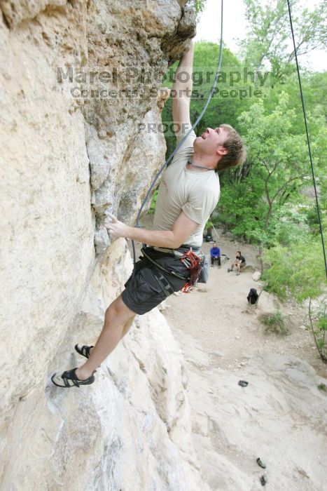 Adam Libson top rope climbing Diving for Rocks (5.10d), photographed from  the third bolt of Magster (5.10a).  It was another long day of rock climbing at Seismic Wall on Austin's Barton Creek Greenbelt, Saturday, April 11, 2009.

Filename: SRM_20090411_16242213.JPG
Aperture: f/4.0
Shutter Speed: 1/250
Body: Canon EOS-1D Mark II
Lens: Canon EF 16-35mm f/2.8 L