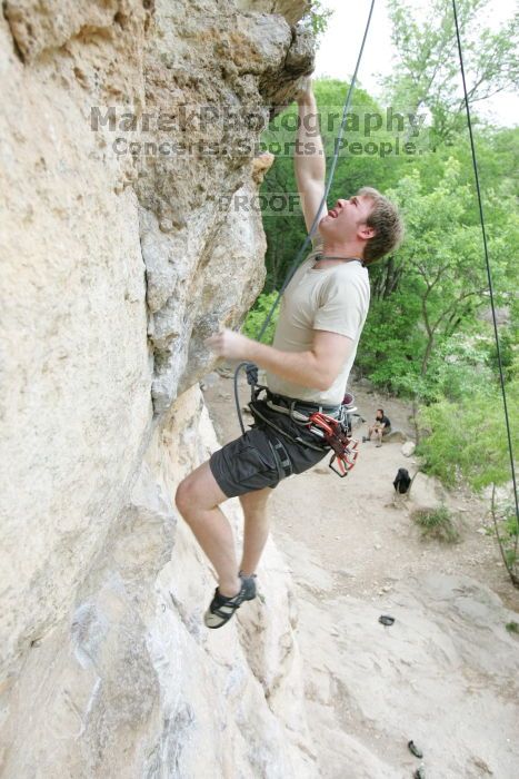 Adam Libson top rope climbing Diving for Rocks (5.10d), photographed from  the third bolt of Magster (5.10a).  It was another long day of rock climbing at Seismic Wall on Austin's Barton Creek Greenbelt, Saturday, April 11, 2009.

Filename: SRM_20090411_16242214.JPG
Aperture: f/4.0
Shutter Speed: 1/250
Body: Canon EOS-1D Mark II
Lens: Canon EF 16-35mm f/2.8 L