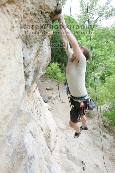 Adam Libson top rope climbing Diving for Rocks (5.10d), photographed from  the third bolt of Magster (5.10a).  It was another long day of rock climbing at Seismic Wall on Austin's Barton Creek Greenbelt, Saturday, April 11, 2009.

Filename: SRM_20090411_16242217.JPG
Aperture: f/4.0
Shutter Speed: 1/250
Body: Canon EOS-1D Mark II
Lens: Canon EF 16-35mm f/2.8 L