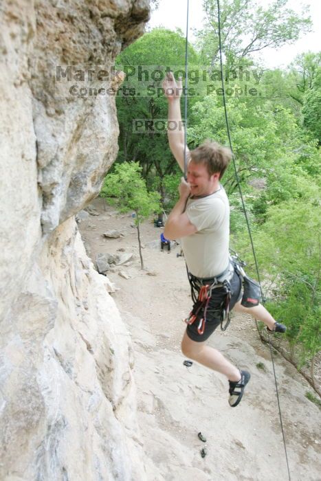 Adam Libson top rope climbing Diving for Rocks (5.10d), photographed from  the third bolt of Magster (5.10a).  It was another long day of rock climbing at Seismic Wall on Austin's Barton Creek Greenbelt, Saturday, April 11, 2009.

Filename: SRM_20090411_16242219.JPG
Aperture: f/4.0
Shutter Speed: 1/250
Body: Canon EOS-1D Mark II
Lens: Canon EF 16-35mm f/2.8 L