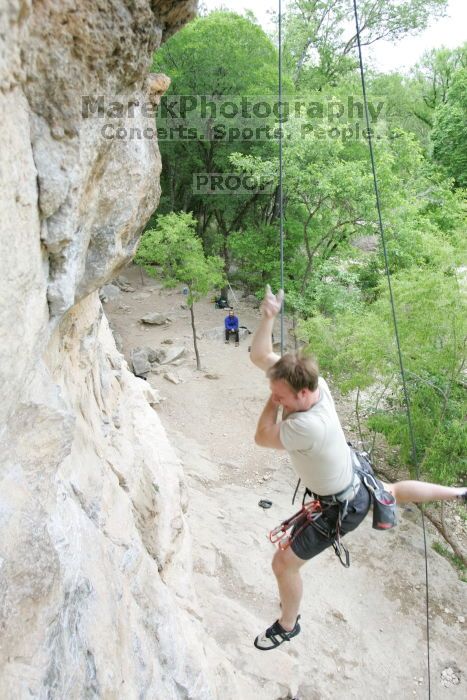 Adam Libson top rope climbing Diving for Rocks (5.10d), photographed from  the third bolt of Magster (5.10a).  It was another long day of rock climbing at Seismic Wall on Austin's Barton Creek Greenbelt, Saturday, April 11, 2009.

Filename: SRM_20090411_16242321.JPG
Aperture: f/4.0
Shutter Speed: 1/250
Body: Canon EOS-1D Mark II
Lens: Canon EF 16-35mm f/2.8 L