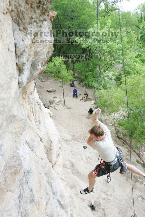 Adam Libson top rope climbing Diving for Rocks (5.10d), photographed from  the third bolt of Magster (5.10a).  It was another long day of rock climbing at Seismic Wall on Austin's Barton Creek Greenbelt, Saturday, April 11, 2009.

Filename: SRM_20090411_16242322.JPG
Aperture: f/4.0
Shutter Speed: 1/250
Body: Canon EOS-1D Mark II
Lens: Canon EF 16-35mm f/2.8 L