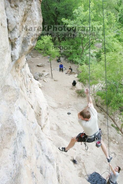 Adam Libson top rope climbing Diving for Rocks (5.10d), photographed from  the third bolt of Magster (5.10a).  It was another long day of rock climbing at Seismic Wall on Austin's Barton Creek Greenbelt, Saturday, April 11, 2009.

Filename: SRM_20090411_16242323.JPG
Aperture: f/4.0
Shutter Speed: 1/250
Body: Canon EOS-1D Mark II
Lens: Canon EF 16-35mm f/2.8 L