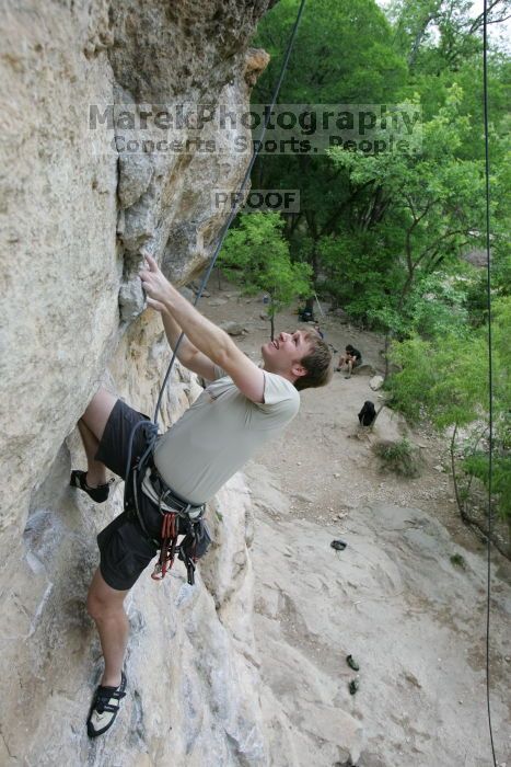 Adam Libson top rope climbing Diving for Rocks (5.10d), photographed from  the third bolt of Magster (5.10a).  It was another long day of rock climbing at Seismic Wall on Austin's Barton Creek Greenbelt, Saturday, April 11, 2009.

Filename: SRM_20090411_16251124.JPG
Aperture: f/5.0
Shutter Speed: 1/400
Body: Canon EOS-1D Mark II
Lens: Canon EF 16-35mm f/2.8 L