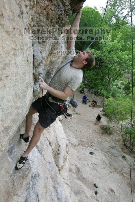 Adam Libson top rope climbing Diving for Rocks (5.10d), photographed from  the third bolt of Magster (5.10a).  It was another long day of rock climbing at Seismic Wall on Austin's Barton Creek Greenbelt, Saturday, April 11, 2009.

Filename: SRM_20090411_16251428.JPG
Aperture: f/5.0
Shutter Speed: 1/400
Body: Canon EOS-1D Mark II
Lens: Canon EF 16-35mm f/2.8 L