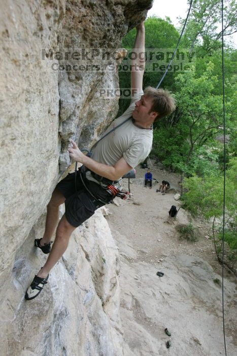 Adam Libson top rope climbing Diving for Rocks (5.10d), photographed from  the third bolt of Magster (5.10a).  It was another long day of rock climbing at Seismic Wall on Austin's Barton Creek Greenbelt, Saturday, April 11, 2009.

Filename: SRM_20090411_16251429.JPG
Aperture: f/5.0
Shutter Speed: 1/400
Body: Canon EOS-1D Mark II
Lens: Canon EF 16-35mm f/2.8 L