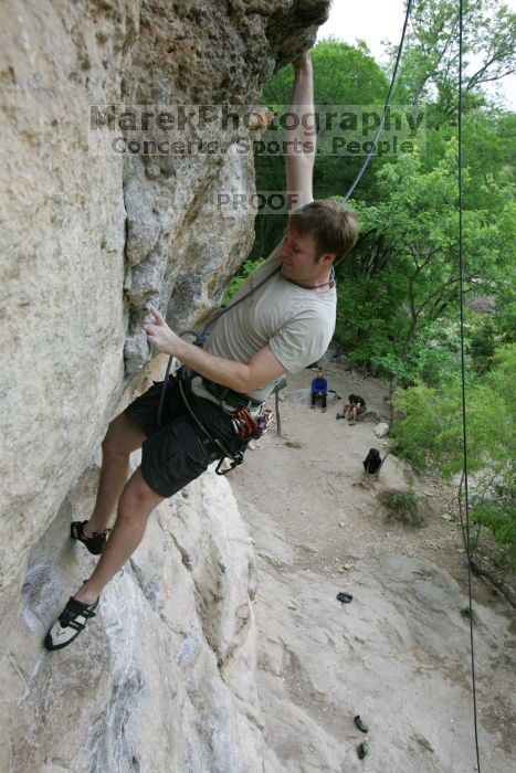 Adam Libson top rope climbing Diving for Rocks (5.10d), photographed from  the third bolt of Magster (5.10a).  It was another long day of rock climbing at Seismic Wall on Austin's Barton Creek Greenbelt, Saturday, April 11, 2009.

Filename: SRM_20090411_16251430.JPG
Aperture: f/5.0
Shutter Speed: 1/400
Body: Canon EOS-1D Mark II
Lens: Canon EF 16-35mm f/2.8 L