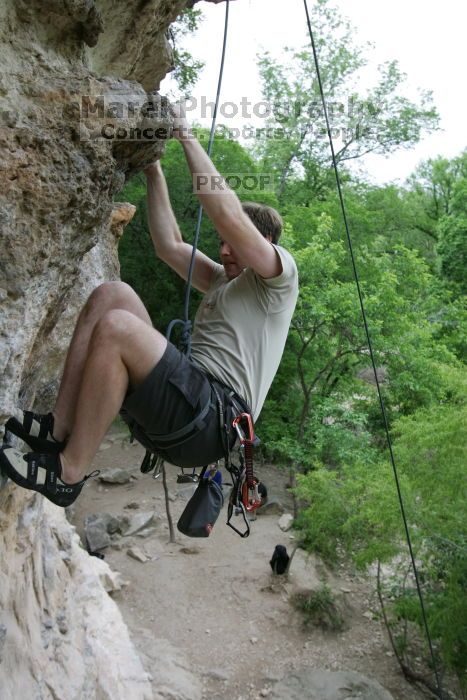 Adam Libson top rope climbing Diving for Rocks (5.10d), photographed from  the third bolt of Magster (5.10a).  It was another long day of rock climbing at Seismic Wall on Austin's Barton Creek Greenbelt, Saturday, April 11, 2009.

Filename: SRM_20090411_16252034.JPG
Aperture: f/5.0
Shutter Speed: 1/400
Body: Canon EOS-1D Mark II
Lens: Canon EF 16-35mm f/2.8 L