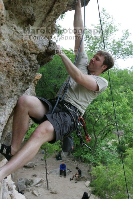 Adam Libson top rope climbing Diving for Rocks (5.10d), photographed from  the third bolt of Magster (5.10a).  It was another long day of rock climbing at Seismic Wall on Austin's Barton Creek Greenbelt, Saturday, April 11, 2009.

Filename: SRM_20090411_16252235.JPG
Aperture: f/5.0
Shutter Speed: 1/400
Body: Canon EOS-1D Mark II
Lens: Canon EF 16-35mm f/2.8 L