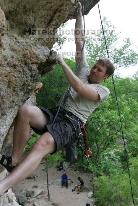 Adam Libson top rope climbing Diving for Rocks (5.10d), photographed from  the third bolt of Magster (5.10a).  It was another long day of rock climbing at Seismic Wall on Austin's Barton Creek Greenbelt, Saturday, April 11, 2009.

Filename: SRM_20090411_16252236.JPG
Aperture: f/5.0
Shutter Speed: 1/400
Body: Canon EOS-1D Mark II
Lens: Canon EF 16-35mm f/2.8 L