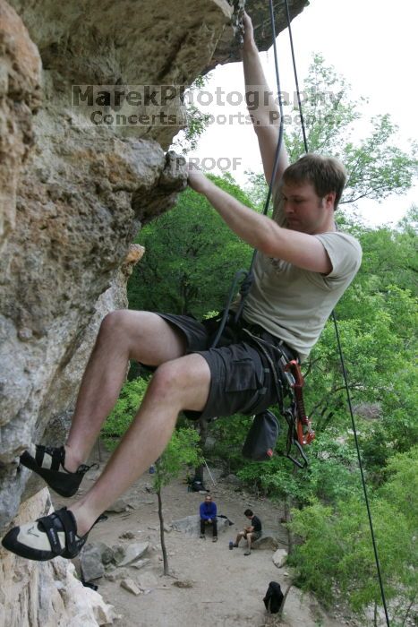 Adam Libson top rope climbing Diving for Rocks (5.10d), photographed from  the third bolt of Magster (5.10a).  It was another long day of rock climbing at Seismic Wall on Austin's Barton Creek Greenbelt, Saturday, April 11, 2009.

Filename: SRM_20090411_16252338.JPG
Aperture: f/5.0
Shutter Speed: 1/400
Body: Canon EOS-1D Mark II
Lens: Canon EF 16-35mm f/2.8 L