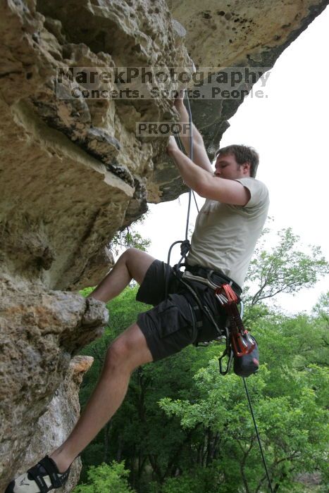 Adam Libson top rope climbing Diving for Rocks (5.10d), photographed from  the third bolt of Magster (5.10a).  It was another long day of rock climbing at Seismic Wall on Austin's Barton Creek Greenbelt, Saturday, April 11, 2009.

Filename: SRM_20090411_16252939.JPG
Aperture: f/5.0
Shutter Speed: 1/400
Body: Canon EOS-1D Mark II
Lens: Canon EF 16-35mm f/2.8 L