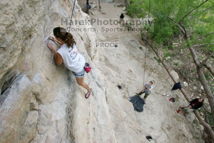 Charlotte Sanders top rope climbing Diving for Rocks (5.10d), photographed from  the third bolt of Magster (5.10a).  It was another long day of rock climbing at Seismic Wall on Austin's Barton Creek Greenbelt, Saturday, April 11, 2009.

Filename: SRM_20090411_16312242.JPG
Aperture: f/5.6
Shutter Speed: 1/320
Body: Canon EOS-1D Mark II
Lens: Canon EF 16-35mm f/2.8 L