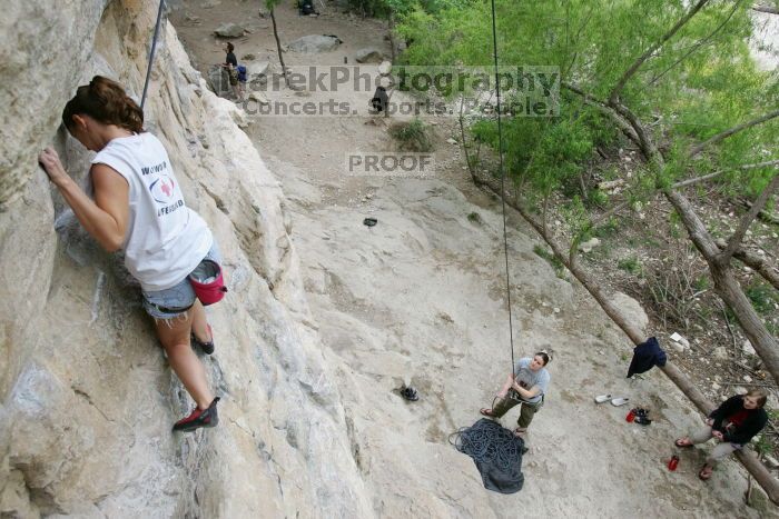 Charlotte Sanders top rope climbing Diving for Rocks (5.10d), photographed from  the third bolt of Magster (5.10a).  It was another long day of rock climbing at Seismic Wall on Austin's Barton Creek Greenbelt, Saturday, April 11, 2009.

Filename: SRM_20090411_16314045.JPG
Aperture: f/5.6
Shutter Speed: 1/320
Body: Canon EOS-1D Mark II
Lens: Canon EF 16-35mm f/2.8 L