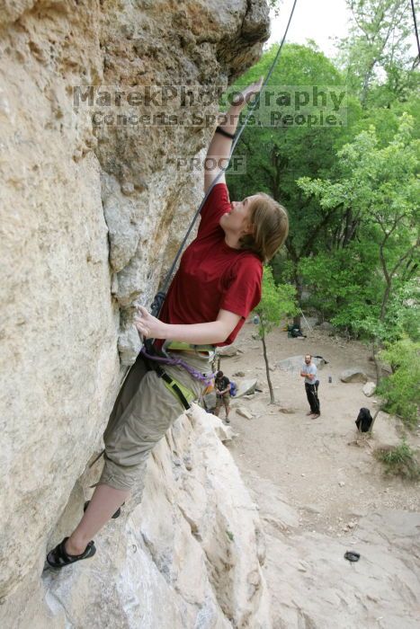 Kirsten Viering top rope climbing Diving for Rocks (5.10d), photographed from  the third bolt of Magster (5.10a).  It was another long day of rock climbing at Seismic Wall on Austin's Barton Creek Greenbelt, Saturday, April 11, 2009.

Filename: SRM_20090411_16374360.JPG
Aperture: f/5.6
Shutter Speed: 1/320
Body: Canon EOS-1D Mark II
Lens: Canon EF 16-35mm f/2.8 L