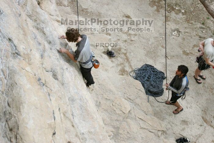 Andrew Dreher top rope climbing Diving for Rocks (5.10d) with Javier Morales belaying, photographed from  the third bolt of Magster (5.10a).  It was another long day of rock climbing at Seismic Wall on Austin's Barton Creek Greenbelt, Saturday, April 11, 2009.

Filename: SRM_20090411_16410067.JPG
Aperture: f/5.6
Shutter Speed: 1/320
Body: Canon EOS-1D Mark II
Lens: Canon EF 16-35mm f/2.8 L