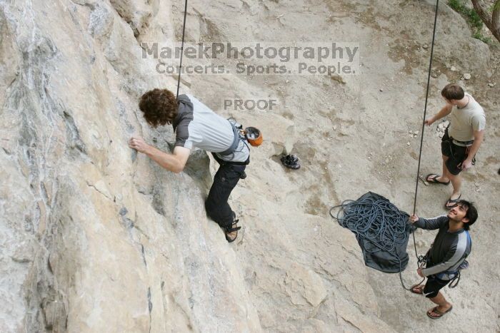 Andrew Dreher top rope climbing Diving for Rocks (5.10d) with Javier Morales belaying, photographed from  the third bolt of Magster (5.10a).  It was another long day of rock climbing at Seismic Wall on Austin's Barton Creek Greenbelt, Saturday, April 11, 2009.

Filename: SRM_20090411_16410869.JPG
Aperture: f/5.6
Shutter Speed: 1/320
Body: Canon EOS-1D Mark II
Lens: Canon EF 16-35mm f/2.8 L