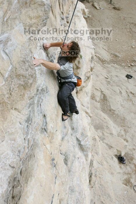 Andrew Dreher top rope climbing Diving for Rocks (5.10d), photographed from  the third bolt of Magster (5.10a).  It was another long day of rock climbing at Seismic Wall on Austin's Barton Creek Greenbelt, Saturday, April 11, 2009.

Filename: SRM_20090411_16412571.JPG
Aperture: f/5.6
Shutter Speed: 1/320
Body: Canon EOS-1D Mark II
Lens: Canon EF 16-35mm f/2.8 L