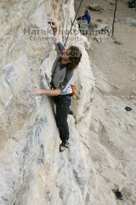 Andrew Dreher top rope climbing Diving for Rocks (5.10d), photographed from  the third bolt of Magster (5.10a).  It was another long day of rock climbing at Seismic Wall on Austin's Barton Creek Greenbelt, Saturday, April 11, 2009.

Filename: SRM_20090411_16413073.JPG
Aperture: f/5.6
Shutter Speed: 1/320
Body: Canon EOS-1D Mark II
Lens: Canon EF 16-35mm f/2.8 L