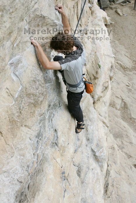 Andrew Dreher top rope climbing Diving for Rocks (5.10d), photographed from  the third bolt of Magster (5.10a).  It was another long day of rock climbing at Seismic Wall on Austin's Barton Creek Greenbelt, Saturday, April 11, 2009.

Filename: SRM_20090411_16414374.JPG
Aperture: f/5.6
Shutter Speed: 1/320
Body: Canon EOS-1D Mark II
Lens: Canon EF 16-35mm f/2.8 L