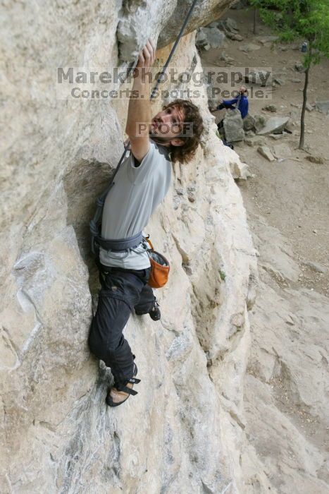 Andrew Dreher top rope climbing Diving for Rocks (5.10d), photographed from  the third bolt of Magster (5.10a).  It was another long day of rock climbing at Seismic Wall on Austin's Barton Creek Greenbelt, Saturday, April 11, 2009.

Filename: SRM_20090411_16415076.JPG
Aperture: f/5.6
Shutter Speed: 1/320
Body: Canon EOS-1D Mark II
Lens: Canon EF 16-35mm f/2.8 L