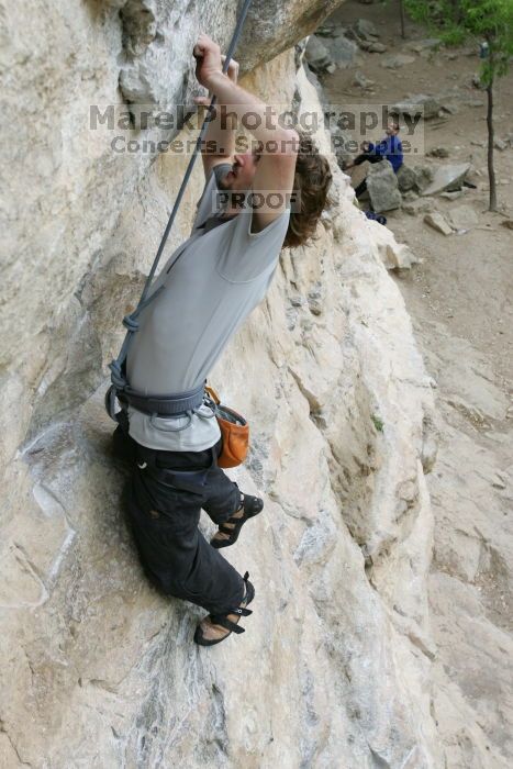 Andrew Dreher top rope climbing Diving for Rocks (5.10d), photographed from  the third bolt of Magster (5.10a).  It was another long day of rock climbing at Seismic Wall on Austin's Barton Creek Greenbelt, Saturday, April 11, 2009.

Filename: SRM_20090411_16415877.JPG
Aperture: f/5.6
Shutter Speed: 1/320
Body: Canon EOS-1D Mark II
Lens: Canon EF 16-35mm f/2.8 L