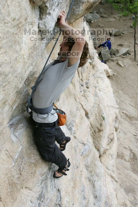 Andrew Dreher top rope climbing Diving for Rocks (5.10d), photographed from  the third bolt of Magster (5.10a).  It was another long day of rock climbing at Seismic Wall on Austin's Barton Creek Greenbelt, Saturday, April 11, 2009.

Filename: SRM_20090411_16415979.JPG
Aperture: f/5.6
Shutter Speed: 1/320
Body: Canon EOS-1D Mark II
Lens: Canon EF 16-35mm f/2.8 L