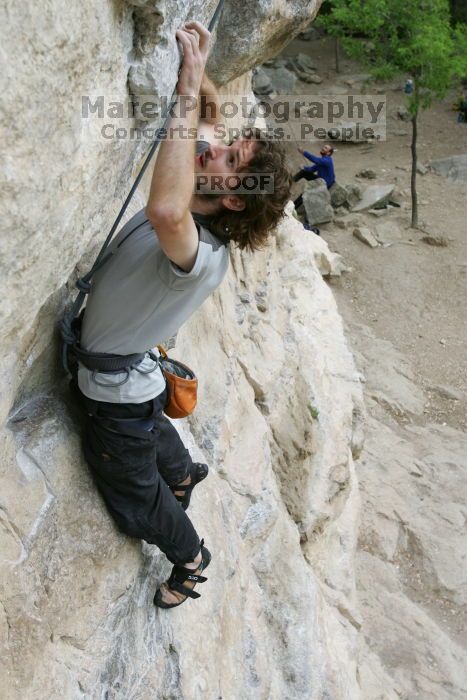 Andrew Dreher top rope climbing Diving for Rocks (5.10d), photographed from  the third bolt of Magster (5.10a).  It was another long day of rock climbing at Seismic Wall on Austin's Barton Creek Greenbelt, Saturday, April 11, 2009.

Filename: SRM_20090411_16420182.JPG
Aperture: f/5.6
Shutter Speed: 1/320
Body: Canon EOS-1D Mark II
Lens: Canon EF 16-35mm f/2.8 L