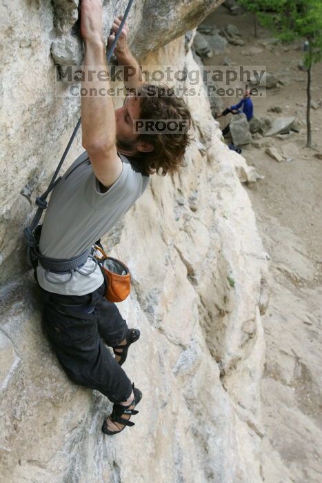 Andrew Dreher top rope climbing Diving for Rocks (5.10d), photographed from  the third bolt of Magster (5.10a).  It was another long day of rock climbing at Seismic Wall on Austin's Barton Creek Greenbelt, Saturday, April 11, 2009.

Filename: SRM_20090411_16420384.JPG
Aperture: f/5.6
Shutter Speed: 1/320
Body: Canon EOS-1D Mark II
Lens: Canon EF 16-35mm f/2.8 L