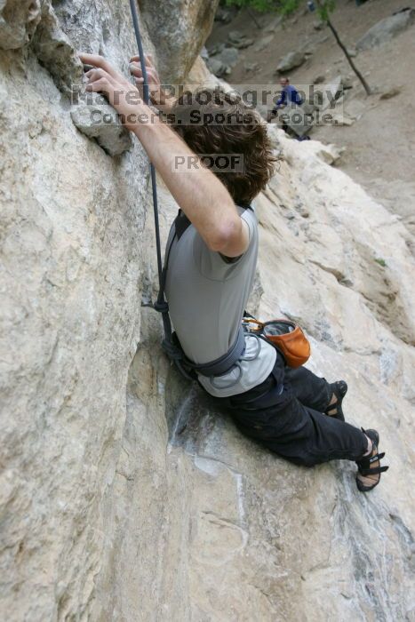 Andrew Dreher top rope climbing Diving for Rocks (5.10d), photographed from  the third bolt of Magster (5.10a).  It was another long day of rock climbing at Seismic Wall on Austin's Barton Creek Greenbelt, Saturday, April 11, 2009.

Filename: SRM_20090411_16421086.JPG
Aperture: f/5.6
Shutter Speed: 1/320
Body: Canon EOS-1D Mark II
Lens: Canon EF 16-35mm f/2.8 L