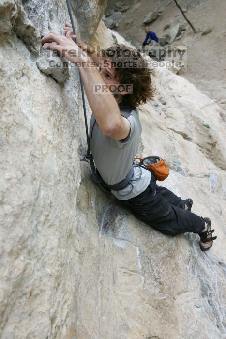 Andrew Dreher top rope climbing Diving for Rocks (5.10d), photographed from  the third bolt of Magster (5.10a).  It was another long day of rock climbing at Seismic Wall on Austin's Barton Creek Greenbelt, Saturday, April 11, 2009.

Filename: SRM_20090411_16421587.JPG
Aperture: f/5.6
Shutter Speed: 1/320
Body: Canon EOS-1D Mark II
Lens: Canon EF 16-35mm f/2.8 L