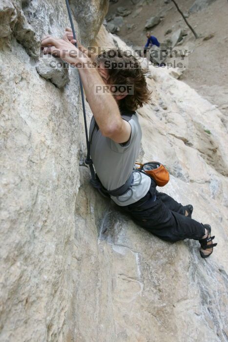 Andrew Dreher top rope climbing Diving for Rocks (5.10d), photographed from  the third bolt of Magster (5.10a).  It was another long day of rock climbing at Seismic Wall on Austin's Barton Creek Greenbelt, Saturday, April 11, 2009.

Filename: SRM_20090411_16421588.JPG
Aperture: f/5.6
Shutter Speed: 1/320
Body: Canon EOS-1D Mark II
Lens: Canon EF 16-35mm f/2.8 L