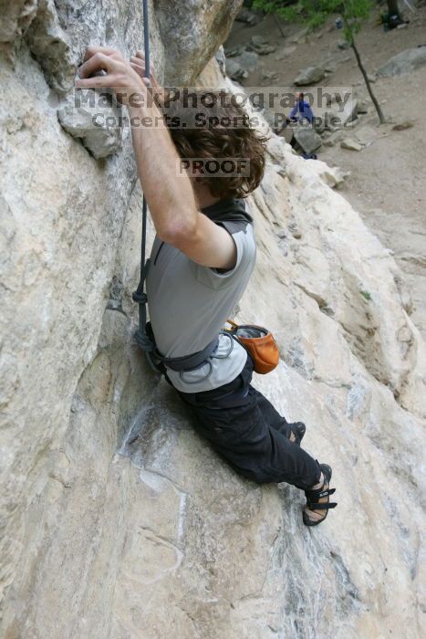 Andrew Dreher top rope climbing Diving for Rocks (5.10d), photographed from  the third bolt of Magster (5.10a).  It was another long day of rock climbing at Seismic Wall on Austin's Barton Creek Greenbelt, Saturday, April 11, 2009.

Filename: SRM_20090411_16421889.JPG
Aperture: f/5.6
Shutter Speed: 1/320
Body: Canon EOS-1D Mark II
Lens: Canon EF 16-35mm f/2.8 L