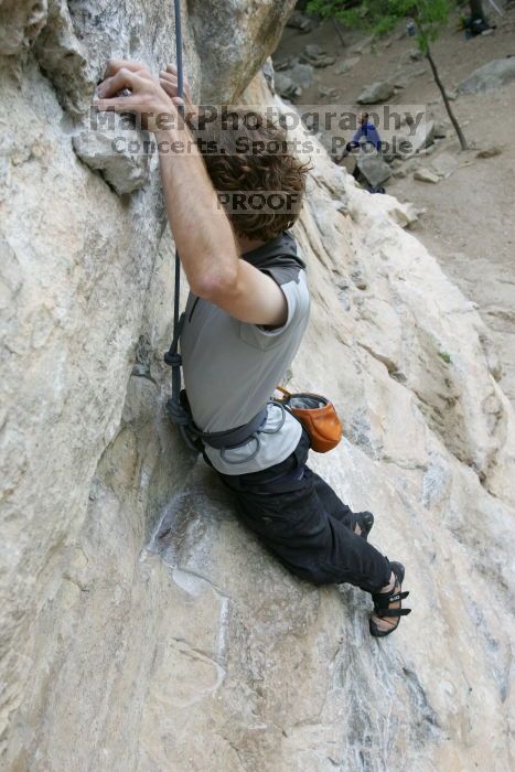 Andrew Dreher top rope climbing Diving for Rocks (5.10d), photographed from  the third bolt of Magster (5.10a).  It was another long day of rock climbing at Seismic Wall on Austin's Barton Creek Greenbelt, Saturday, April 11, 2009.

Filename: SRM_20090411_16421990.JPG
Aperture: f/5.6
Shutter Speed: 1/320
Body: Canon EOS-1D Mark II
Lens: Canon EF 16-35mm f/2.8 L