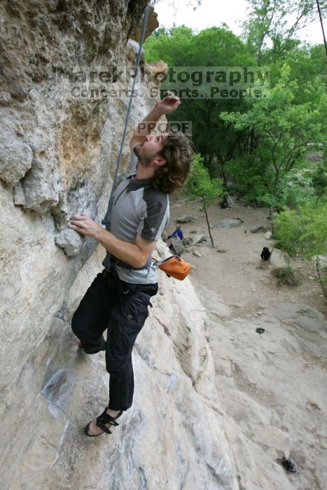 Andrew Dreher top rope climbing Diving for Rocks (5.10d), photographed from  the third bolt of Magster (5.10a).  It was another long day of rock climbing at Seismic Wall on Austin's Barton Creek Greenbelt, Saturday, April 11, 2009.

Filename: SRM_20090411_16423892.JPG
Aperture: f/5.6
Shutter Speed: 1/320
Body: Canon EOS-1D Mark II
Lens: Canon EF 16-35mm f/2.8 L